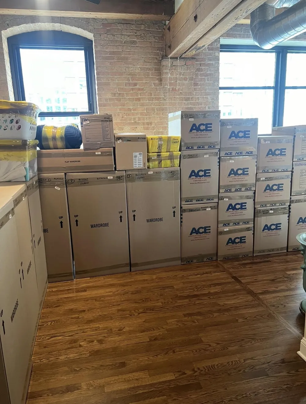 Fully packed and labeled wardrobe boxes ready for a Boston Seaport move