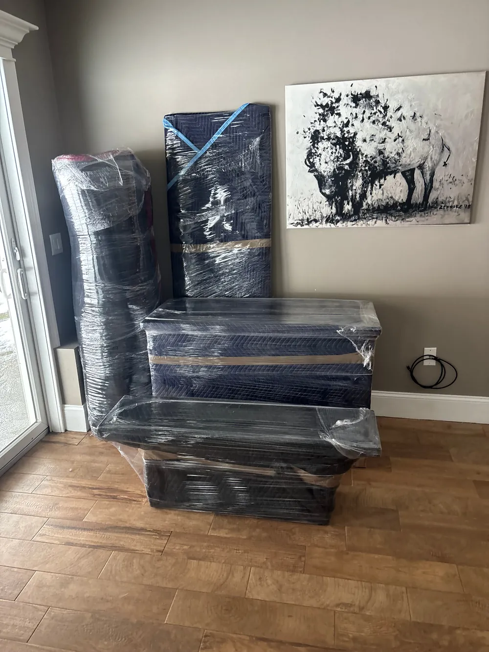 Furniture professionally padded and stretch-wrapped for a Cumberland, RI move