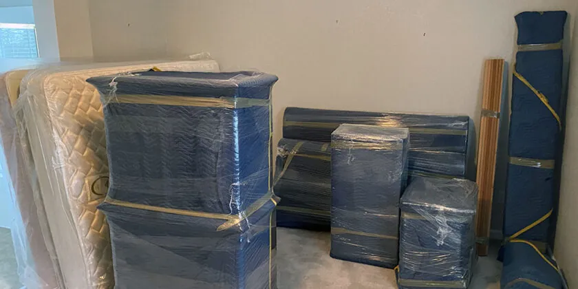 Wrapped and padded furniture staged for a Hollis, NH move